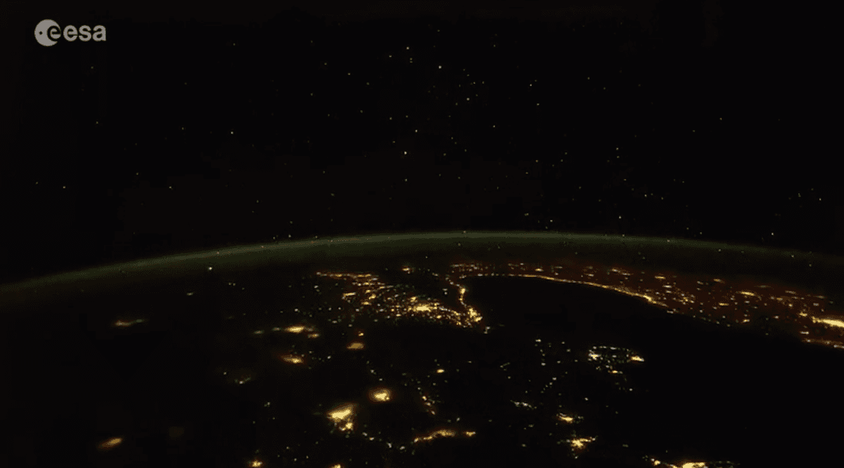 Stars and city lights on Earth at night