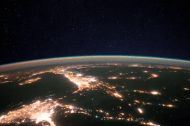 Why does Earth appear to glow from space?