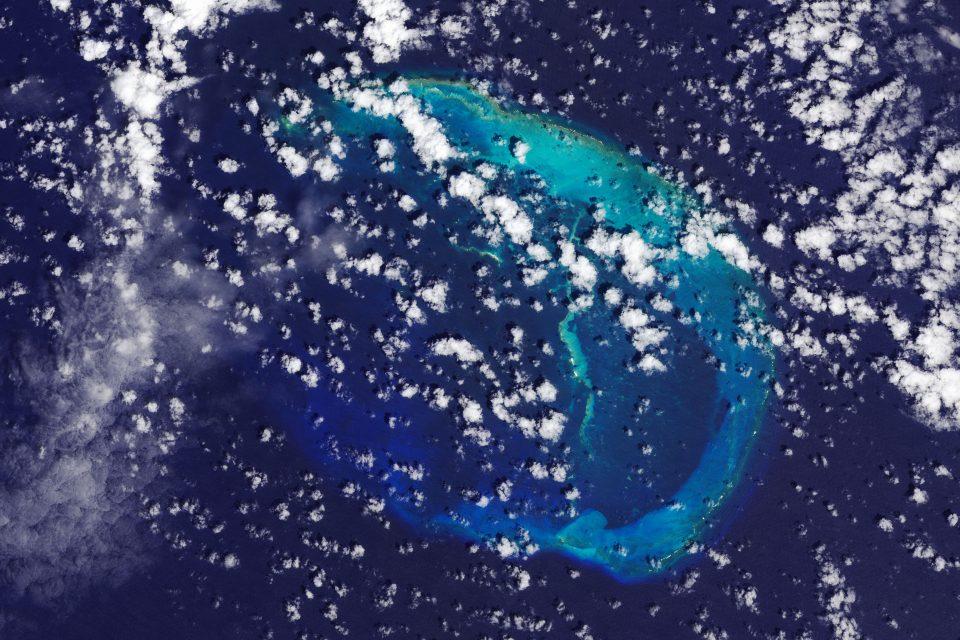 East Island disappears into the Pacific Ocean
