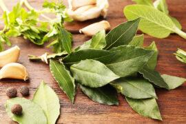Aromatic,Fresh,Bay,Leaves,And,Spices,On,Wooden,Table,,Closeup