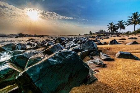 Beach,With,Red,Sand,And,Black,Rocks,With,A,Beautiful