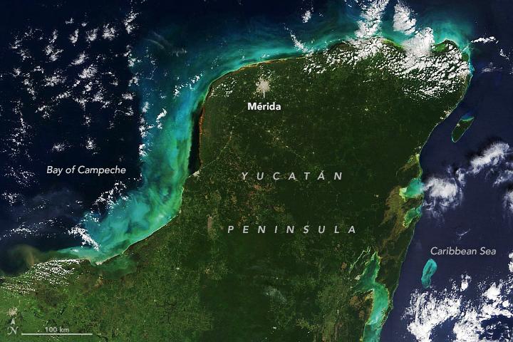Bright sediment swirls surrounding the Yucatán Peninsula