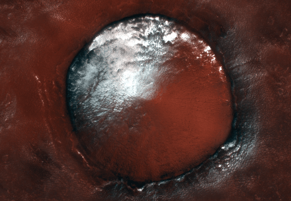 White water-ice against the rusty red soil of Mars