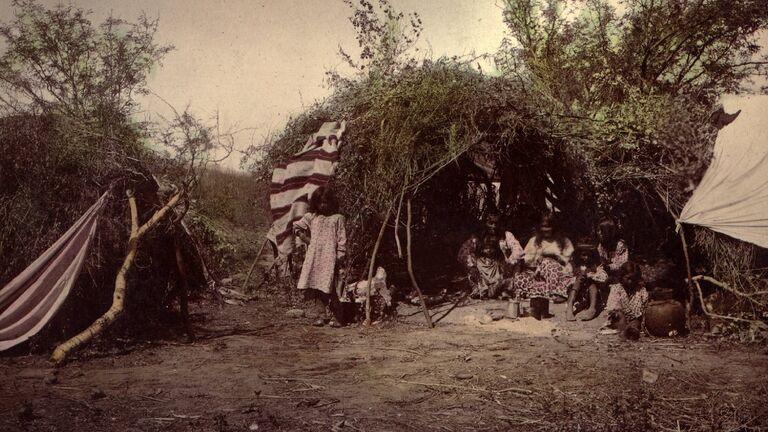 Chiricahua Apache medicine man with his family
