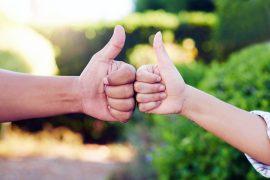 Outdoor,,Couple,And,Thumbs,Up,For,Support,,Fist,Bump,And